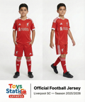 Two children wearing red Liverpool football jerseys on a white background with Toys StationExpress branding.